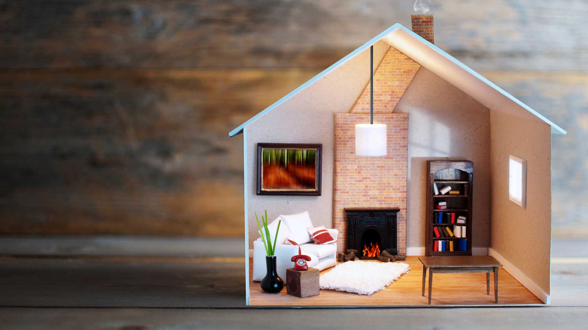 model domu od wewnątrz z kominkiem i białą sofą