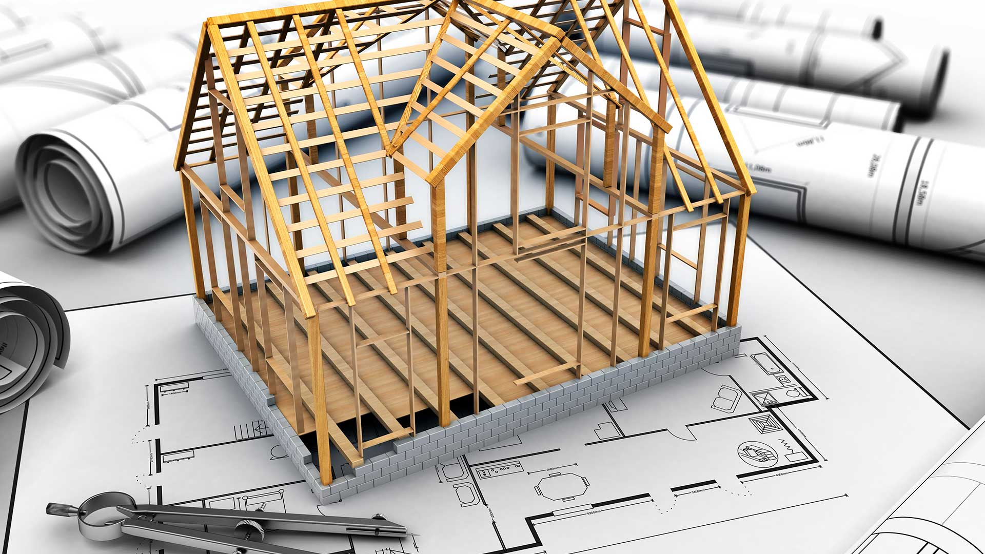 cyrkiel i makieta domu leżące na projekcie domu szkieletowego -  w 2021