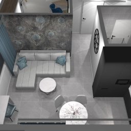 Projektowanie Wnętrz Katarzyna Ćwiek - Wizualizacja z góry: salon z szarą sofą, wzorzystą tapetą i niebieskimi akcentami, połączony z kuchnią w czerni i bieli. Nowoczesny design z dbałością o detale.