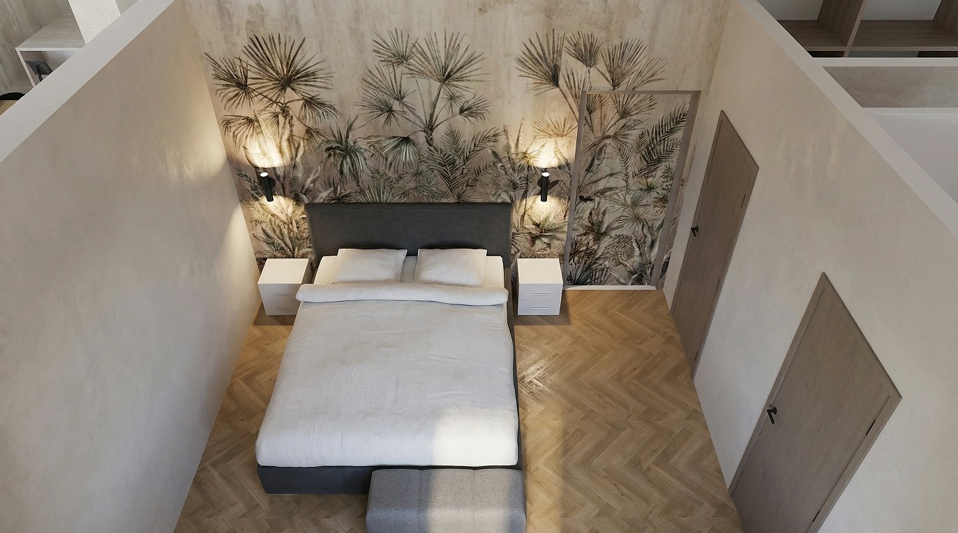 Sypialnia z łóżkiem, szafkami nocnymi i tapetą w tropikalne liście. Ujęcie z góry ukazuje parkiet w jodełkę i drzwi w kolorze drewna. Minimalistyczny design z akcentem natury.