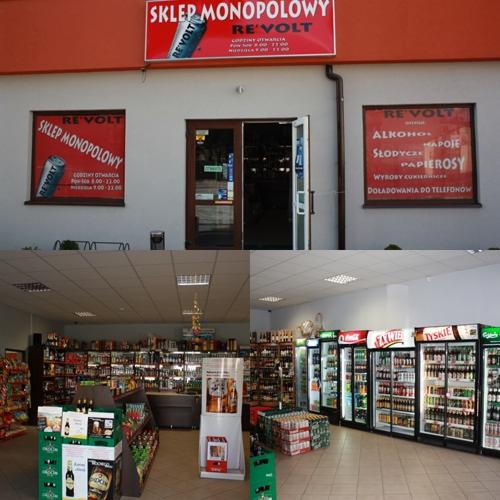 Fasada i wnętrze sklepu monopolowego Re'Volt z szyldem, plakatami informacyjnymi i regałami pełnymi alkoholi oraz lodówkami z napojami.