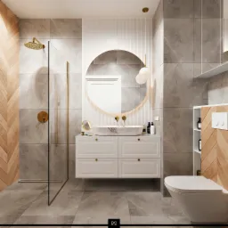 Elegancka łazienka z marmurową umywalką, okrągłym lustrem z podświetleniem, kabiną prysznicową ze złotymi detalami i drewnianą mozaiką na ścianie.