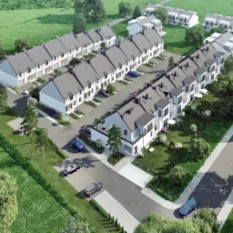 Wizualizacja osiedla domów szeregowych z szarymi dachami, białą elewacją, małymi ogródkami i podjazdami, widziana z lotu ptaka, z zaparkowanymi samochodami i zielonym otoczeniem.
