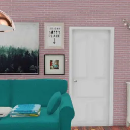 Turkusowa sofa z poduszkami i kocami na tle ceglanej ściany z obrazami i białej komody z wazonem i gałązkami.