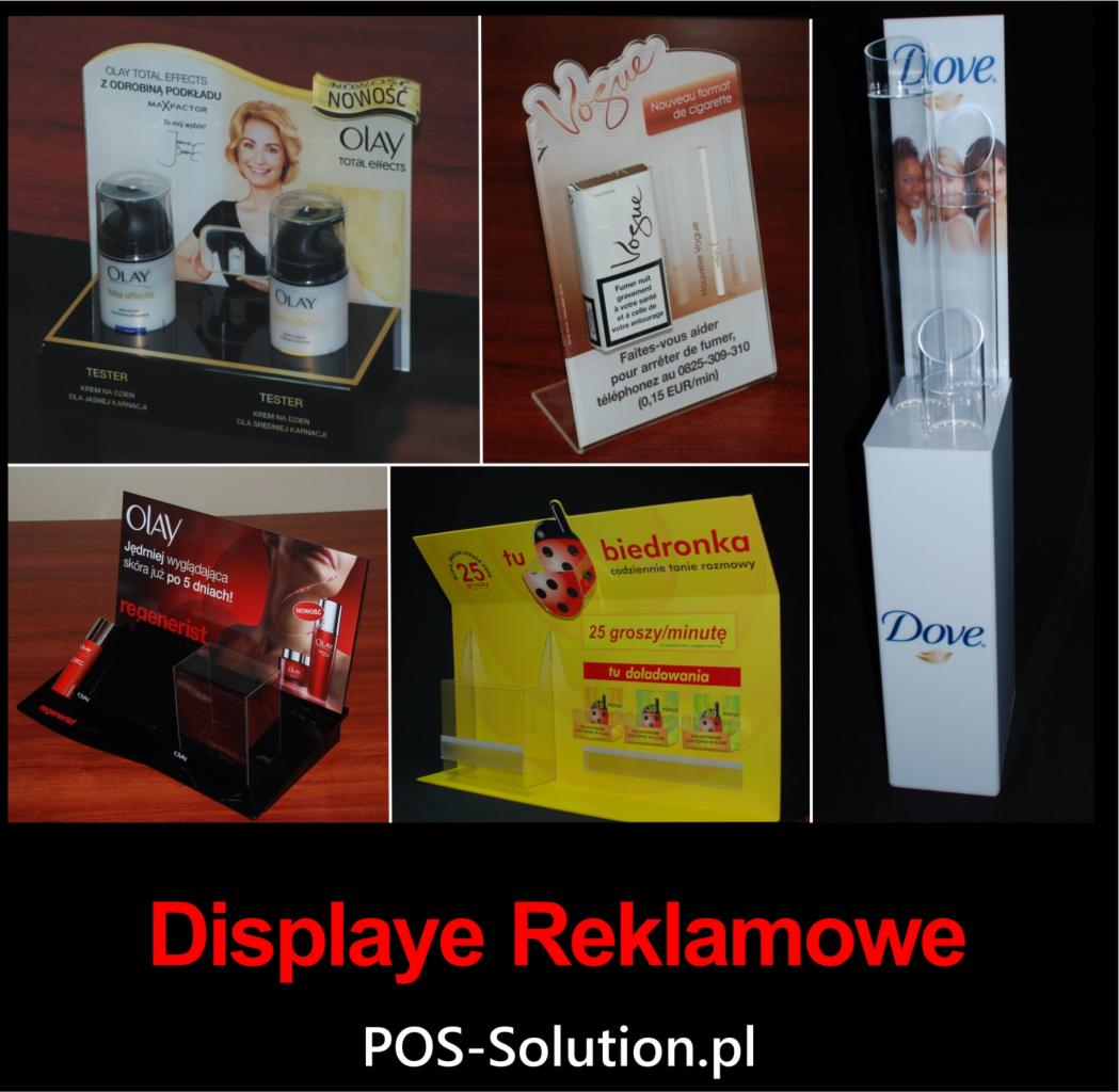 Zestaw ekspozycyjnych displayów reklamowych różnych marek kosmetycznych i Biedronki, prezentujący produkty na ladach sklepowych, każdy z indywidualnym projektem graficznym i materiałami.