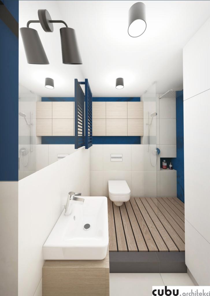 Wizualizacja nowoczesnej łazienki z drewnianą podłogą w strefie prysznicowej, białą ceramiką i akcentami w kolorze granatowym, oświetlona przez trzy punktowe lampy sufitowe i lampę dwupunktową.