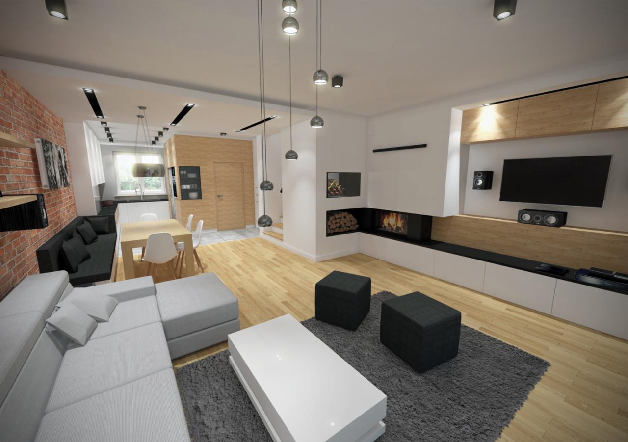 Wnętrze przestronnego salonu z ceglaną ścianą, narożną sofą, kominkiem i telewizorem, oświetlone wiszącymi lampami.