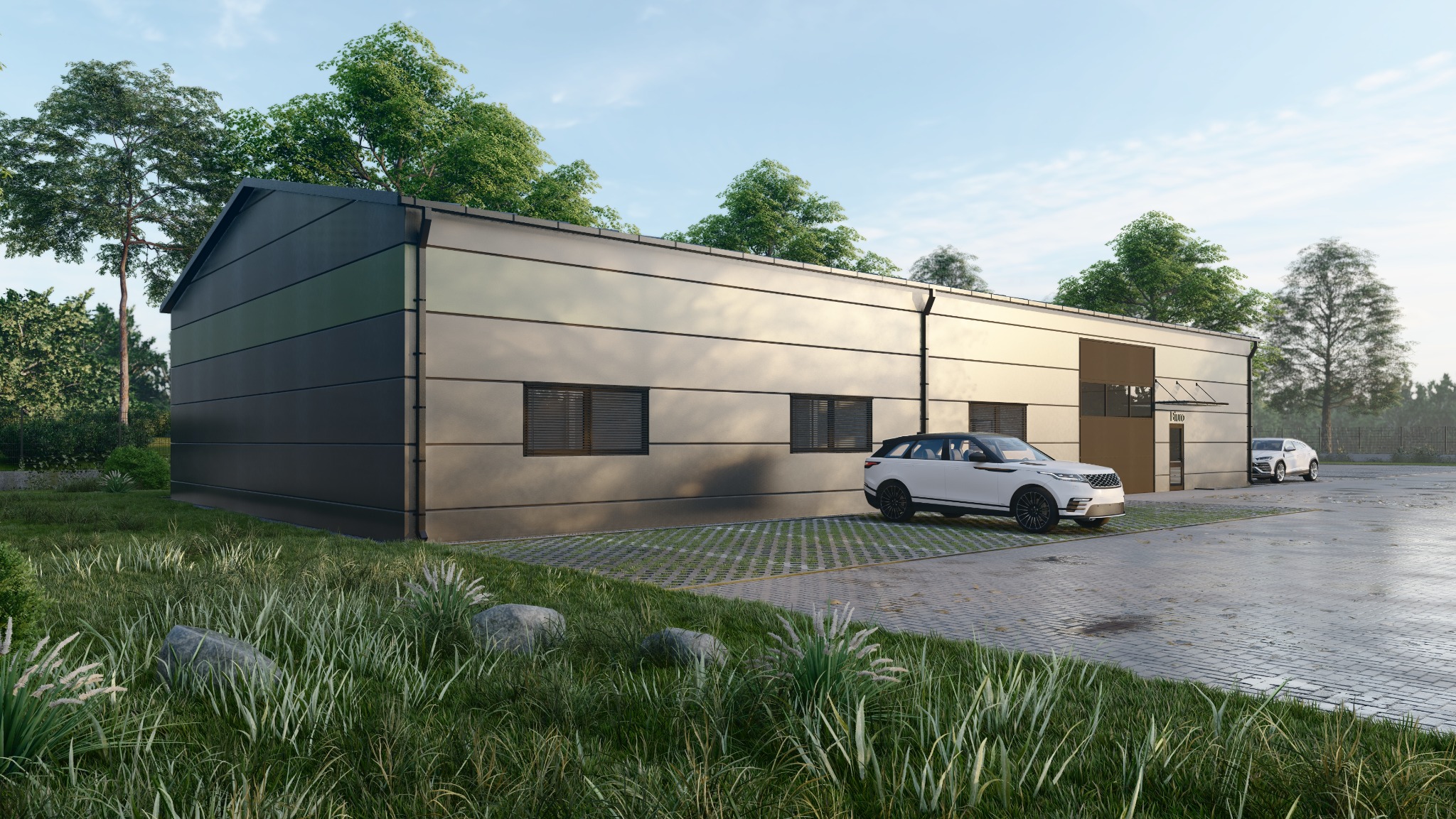 Nowoczesna hala w ciemnej i jasnej kolorystyce z zaparkowanymi dwoma białymi samochodami, otoczona zielenią i kostką ażurową.