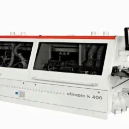 Profesjonalna obrabiarka krawędziowa z panelem sterowania, model Olimpic K 400, widoczne elementy wewnętrzne maszyny.