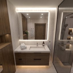 House-Design - Współczesna łazienka z drewnianymi szafkami, jasnym blatem, podświetlanym lustrem i przeszkloną kabiną prysznicową z deszczownicą. Ryflowane panele i zintegrowane oświetlenie LED.