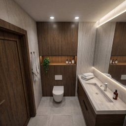 House-Design - Nowoczesna łazienka z ciemnymi drewnianymi szafkami, jasnoszarymi płytkami, podświetlanym lustrem nad zintegrowaną umywalką i wiszącą toaletą. Widoczne dekoracje i ręczniki.