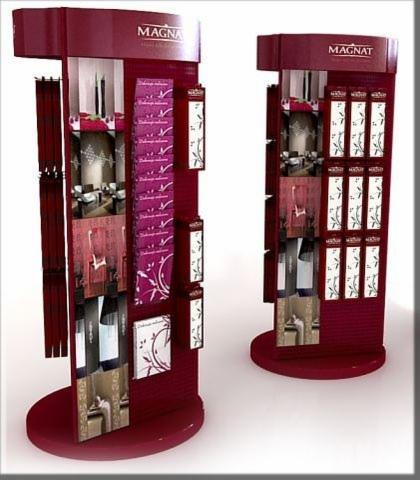 Dwa bordowe stojaki reklamowe z metalowymi elementami, prezentujące próbki i grafiki, z logo 'MAGNA' i 'MAGNAT' na górze, na białym tle.