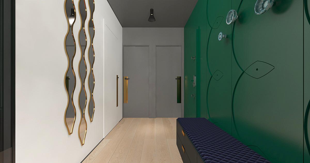 Nowoczesny przedpokój z zieloną ścianą zdobioną motywem roślinnym, podłużną pufą z pikowanym siedziskiem i zestawem trzech podłużnych, falistych luster w złotych ramach.