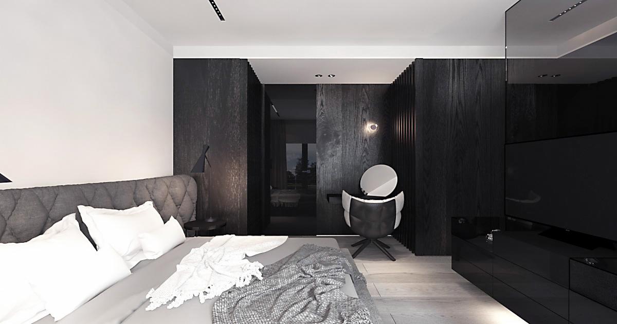 Nowoczesna sypialnia w minimalistycznym stylu z szarą tapicerowaną ramą łóżka, białymi poduszkami, szarym pledem i czarnymi drewnianymi panelami ściennymi oraz toaletką z okrągłym lustrem.