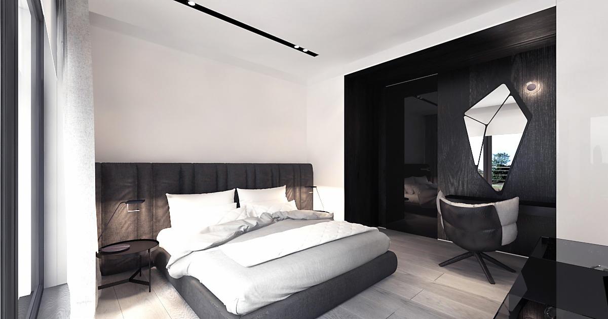 Nowoczesna sypialnia w odcieniach szarości z dużym łóżkiem, geometrycznym lustrem i krzesłem obrotowym, oświetlona listwą LED na suficie.