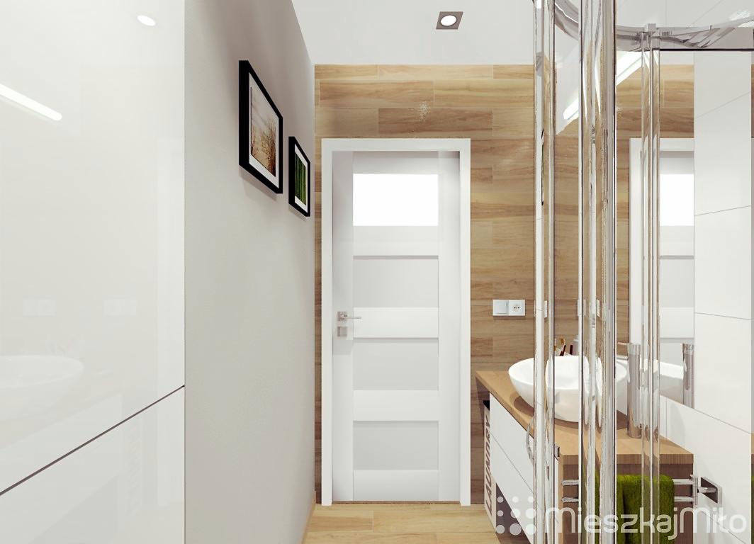 Wizualizacja nowoczesnej łazienki z drewnopodobnymi płytkami, białą umywalką nablatową i kabiną prysznicową typu walk-in, uzupełniona o minimalistyczne dekoracje ścienne.