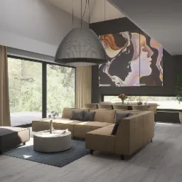 Jasny salon z narożną sofą w odcieniach beżu, okrągłym stolikiem kawowym na dywanie, dużą grafiką na ścianie i widokiem na zieleń za oknem.