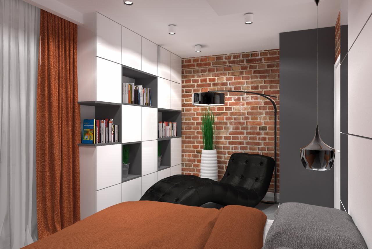 Nowoczesna sypialnia w Katowicach z ceglaną ścianą, czarnym leżankowym fotelem i regałem z książkami, oświetlona wiszącą lampą w stylu industrialnym.