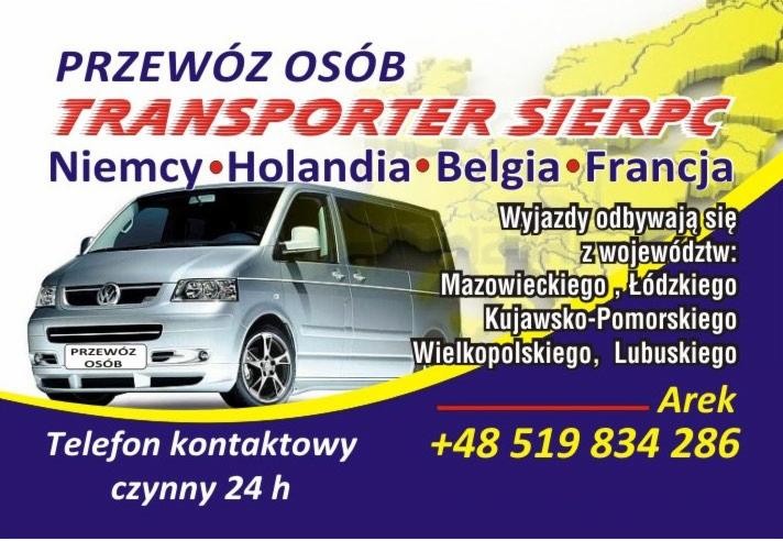 Srebrny bus marki Volkswagen Transporter z napisem 'PRZEWÓZ OSÓB' na tablicy rejestracyjnej, oferujący transport do Niemiec, Holandii, Belgii i Francji, z informacją o wyjazdach z województw...