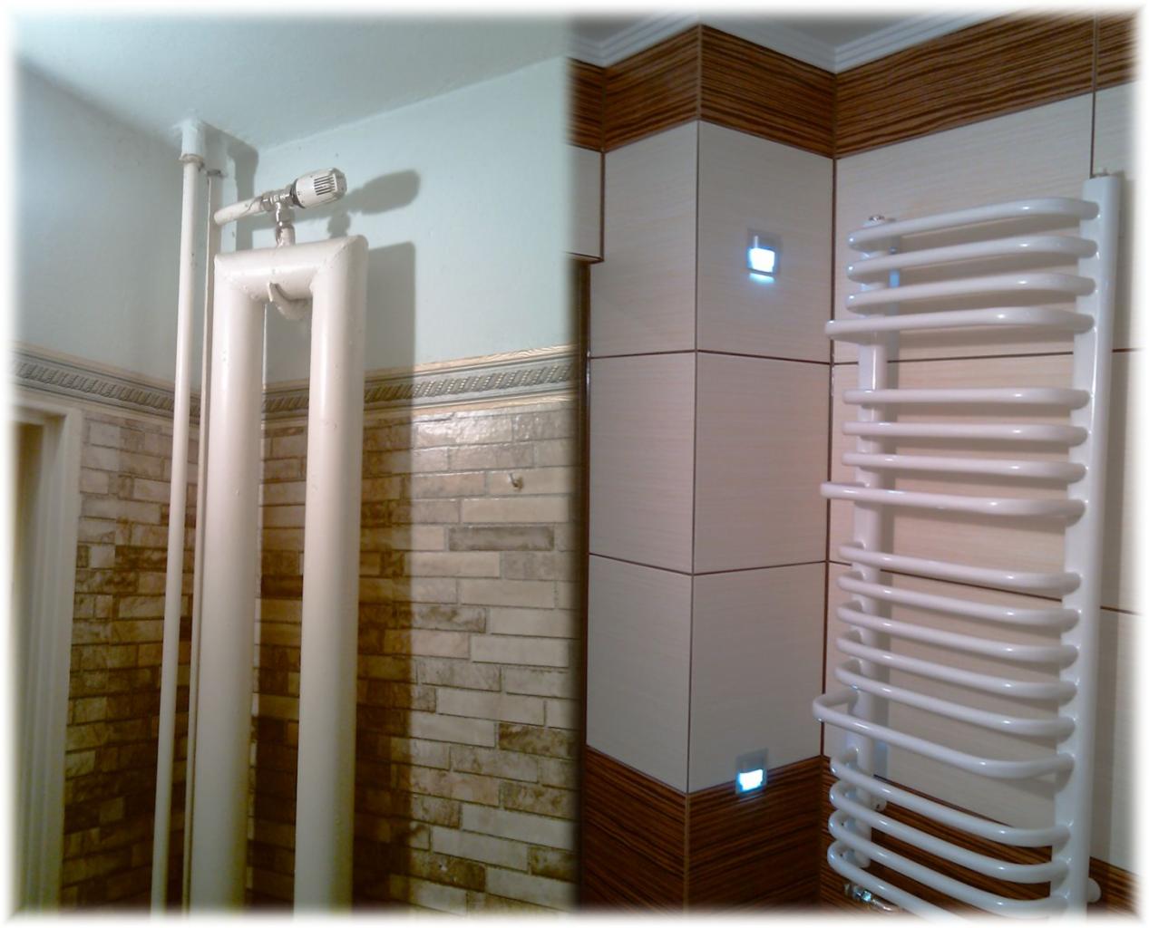 Białe rury grzejne z termostatem na tle ceramicznej ściany w łazience, obok grzejnik drabinkowy i podświetlane płytki.