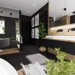 Nowoczesna łazienka z czarnymi ścianami, drewnianymi akcentami i białymi elementami sanitarnymi, oświetlona listwą LED nad umywalką, z dekoracjami w postaci czarno-białych grafik i roślin...