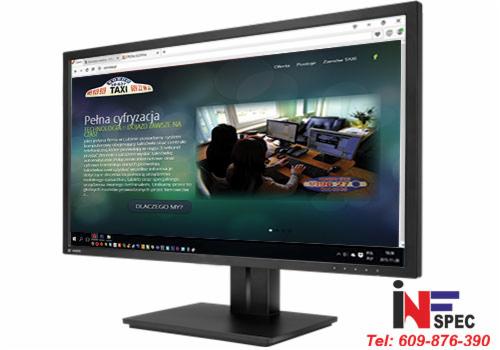 Monitor wyświetla stronę internetową z motywem taxi, ukazując nowoczesny design i funkcjonalność. Widoczne elementy graficzne i tekst 'Pełna cyfryzacja'.