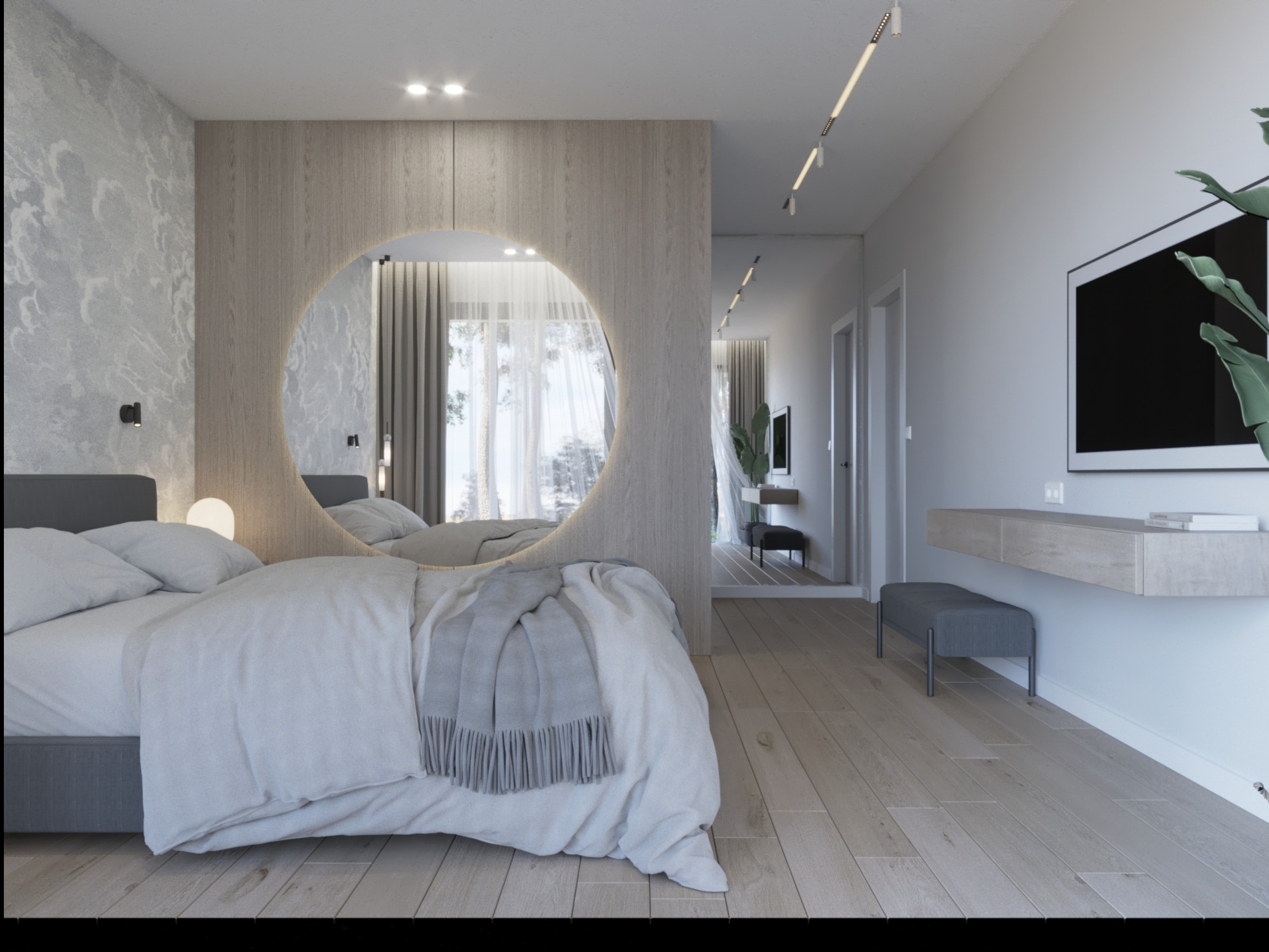 Nowoczesna sypialnia z łóżkiem w odcieniach szarości, okrągłym lustrem w drewnianej obudowie i widokiem na dalszą część mieszkania.