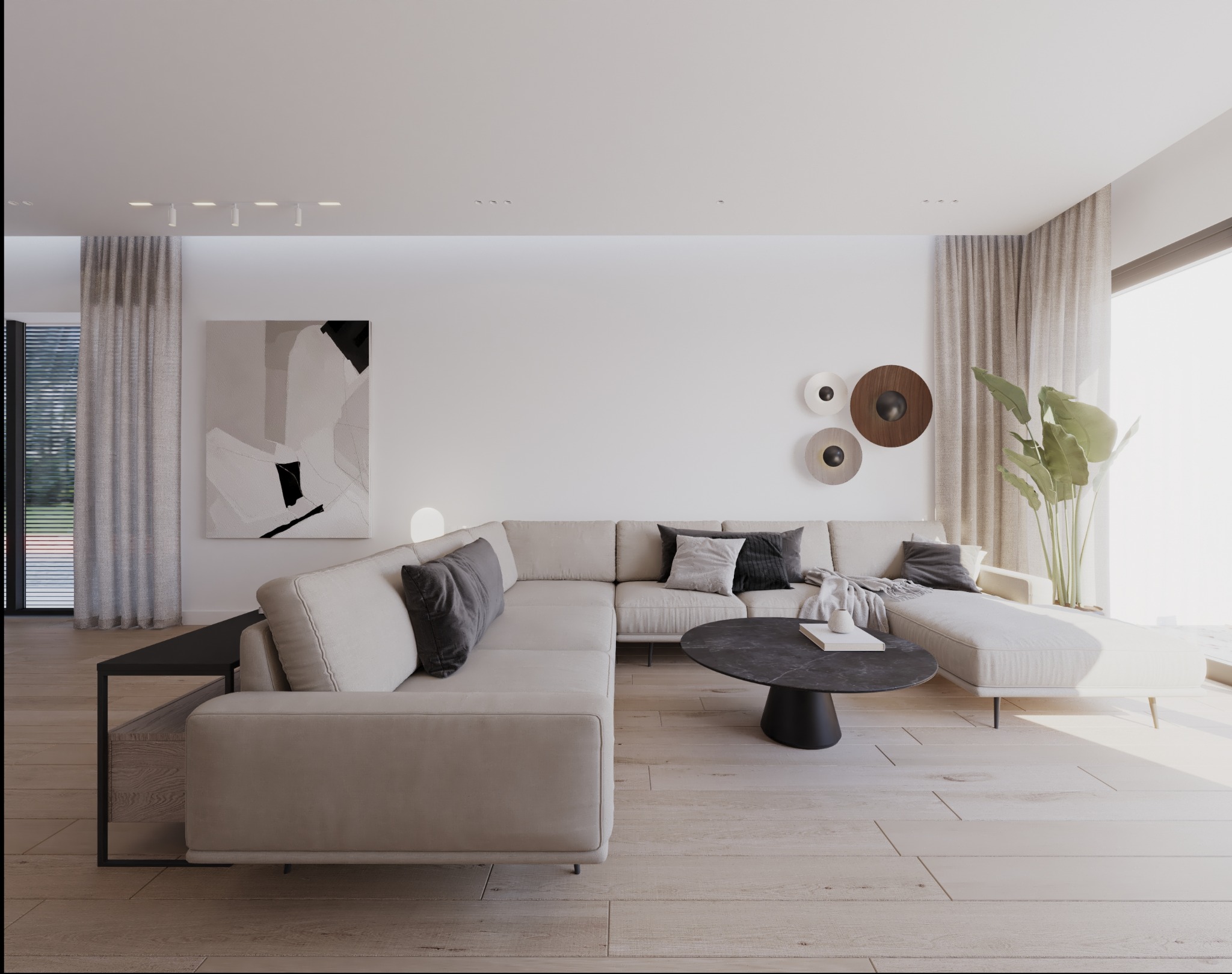 Jasny salon z narożną sofą, okrągłym stolikiem kawowym z czarnym blatem, abstrakcyjnym obrazem na ścianie i dekoracyjnymi talerzami.