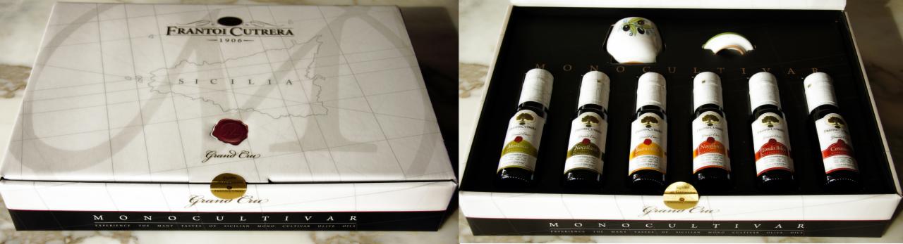 Elegancki zestaw degustacyjny oliwy Frantoi Cutrera z mapą Sycylii na pudełku, prezentujący różnorodne smaki w małych butelkach.