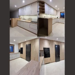 Nowoczesna kuchnia z jasnymi, lakierowanymi frontami szafek i drewnianymi akcentami. Widoczne oświetlenie podszafkowe i sprzęt AGD w zabudowie.