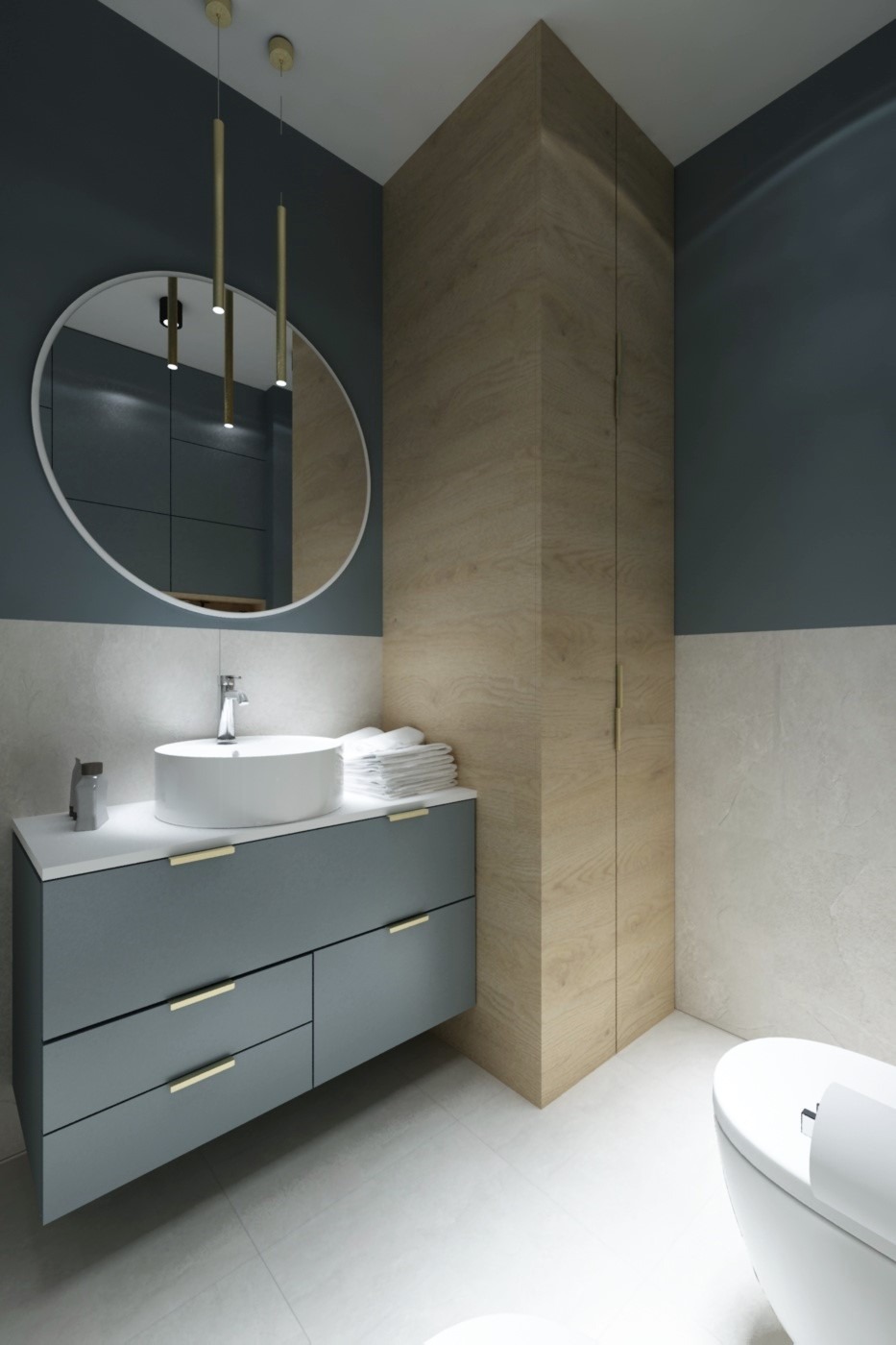 Nowoczesna łazienka z szarą szafką pod umywalką, okrągłym lustrem, złotymi lampami wiszącymi i drewnianą szafą wnękową.
