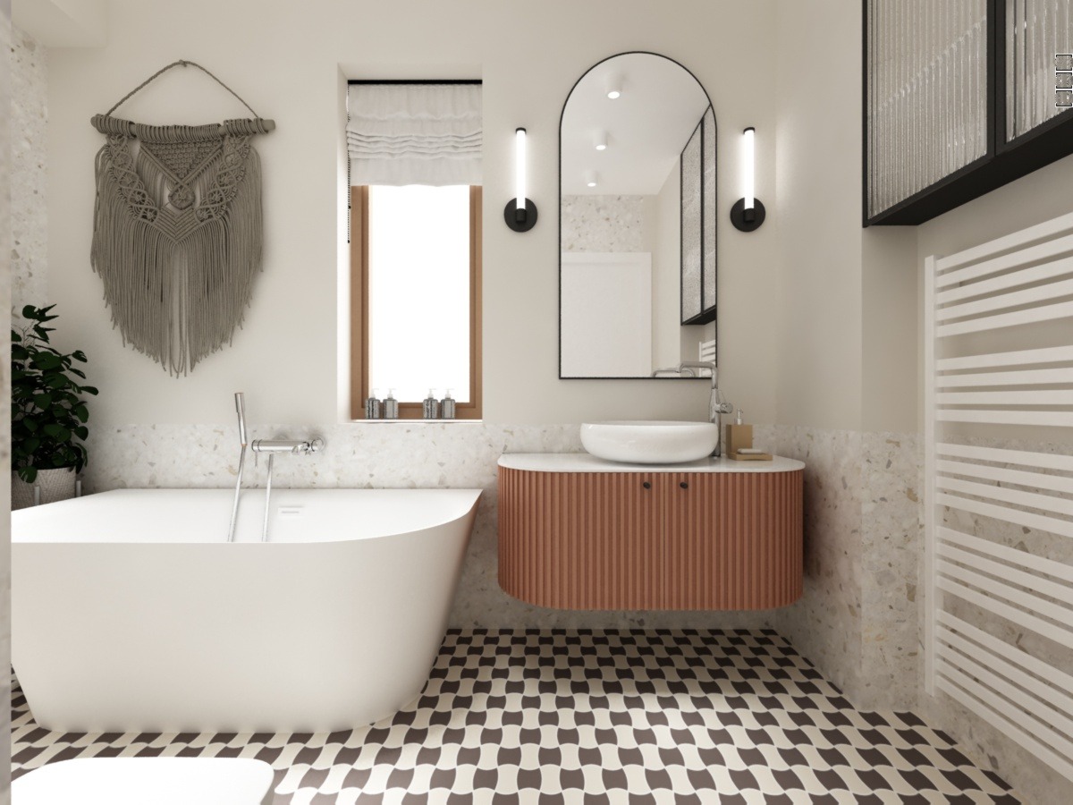 Nowoczesna łazienka z wolnostojącą wanną, umywalką nablatową na szafce z lamelami w kolorze terakoty i lustrem w czarnej ramie, uzupełniona dekoracją makramową na ścianie i grzejnikiem drabinkowym.