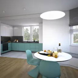 Wnętrze nowoczesnej kuchni z turkusowymi szafkami, białymi górnymi szafkami i blatem z ciemnego kamienia. Na okrągłym stole stoją szklanki z napojem, butelka i owoce, a obok okna znajduje się...