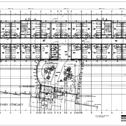JurCAD Pracownia Architektoniczna Krzysztof Jur - Techniczny rysunek architektoniczny przedstawiający plan budynku wielorodzinnego z zaznaczoną zielenią wokół, widok z góry.