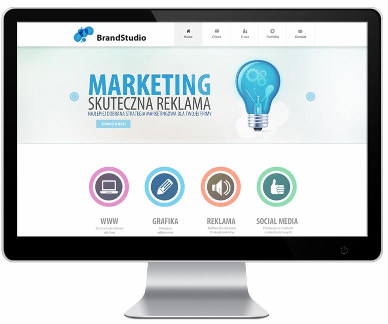 Ekran monitora wyświetlający stronę internetową agencji BrandStudio z hasłem 'Marketing Skuteczna Reklama' i ikonami WWW, Grafika, Reklama, Social Media.