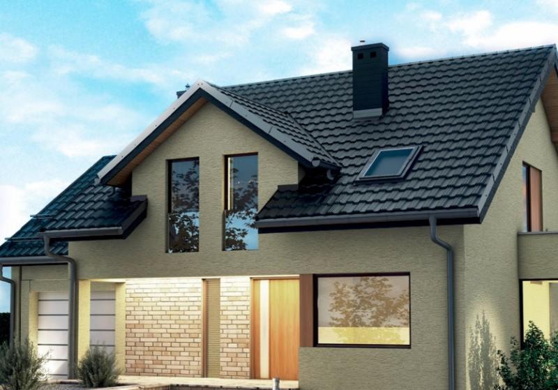 Dom jednorodzinny z ciemną dachówką Germania Simetric o matowym wykończeniu TK i widocznym oknem dachowym oraz rynną w kolorze dachu.