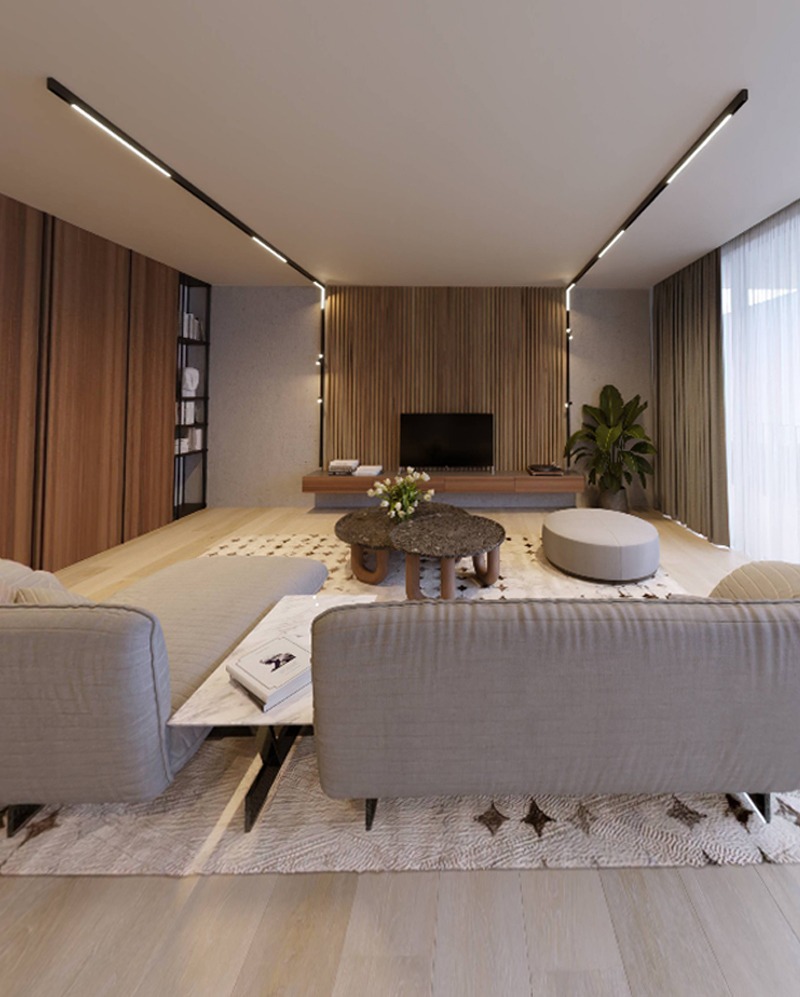 Nowoczesny salon z oświetleniem liniowym LED w czarnych profilach, drewnianą ścianą TV i jasną sofą. Minimalistyczny design, ciepłe światło.