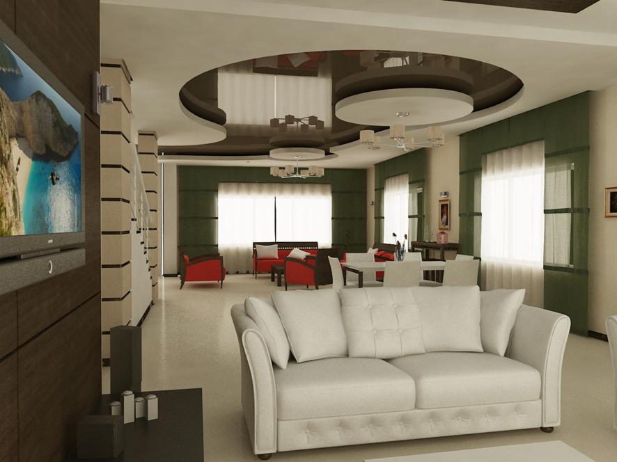 Elegancki salon z sofą w odcieniach bieli, czerwonymi fotelami i dużym telewizorem. Sufit podwieszany z oświetleniem punktowym. Nowoczesny design wnętrza.