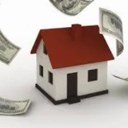 Stylizowana wizualizacja małego, białego domu z czerwonym dachem otoczonego spadającymi banknotami studolarowymi na białym tle.