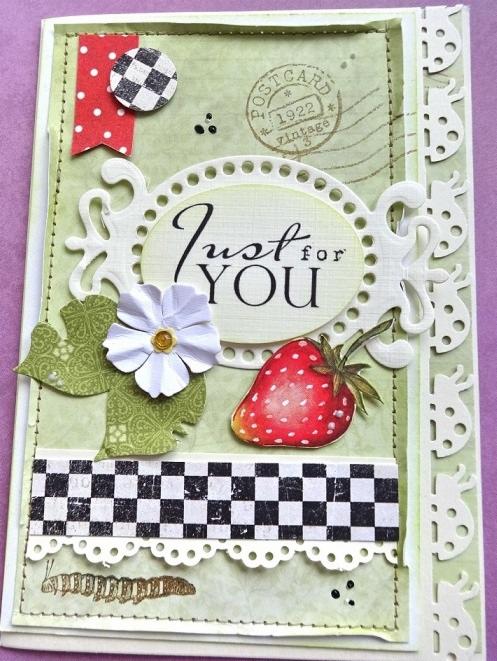 Ręcznie robiona kartka okolicznościowa z napisem 'Just for YOU', ozdobiona truskawką, kwiatem i wzorami w kratkę, utrzymana w pastelowej kolorystyce.