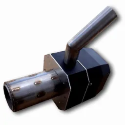 Palnik pelletowy z obrotową komorą spalania, widok z góry na czarną, wielokątną obudowę i metalowy wylot spalin pod kątem, spawany cylinder z otworami.