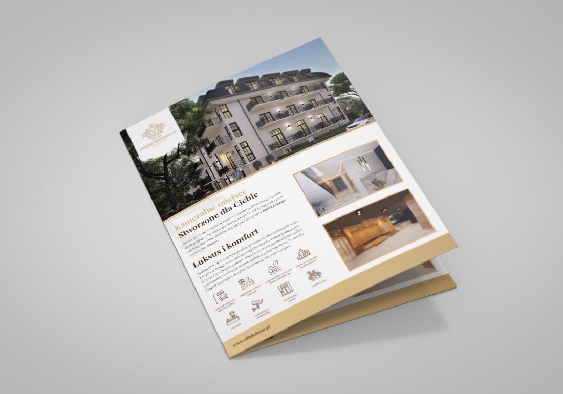Rozłożona ulotka reklamowa z wizualizacjami budynku apartamentowego i wnętrz, na jasnoszarym tle.