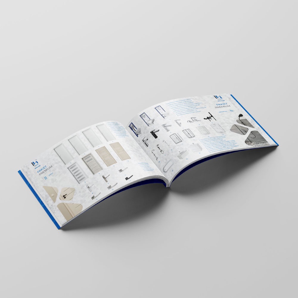 Otwarty katalog produktowy z ilustracjami armatury łazienkowej i drzwi, leżący na szarym tle.