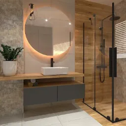 Nowoczesna łazienka z kabiną prysznicową typu walk-in, okrągłym lustrem z podświetleniem LED i drewnianymi akcentami. Minimalistyczna umywalka nablatowa.