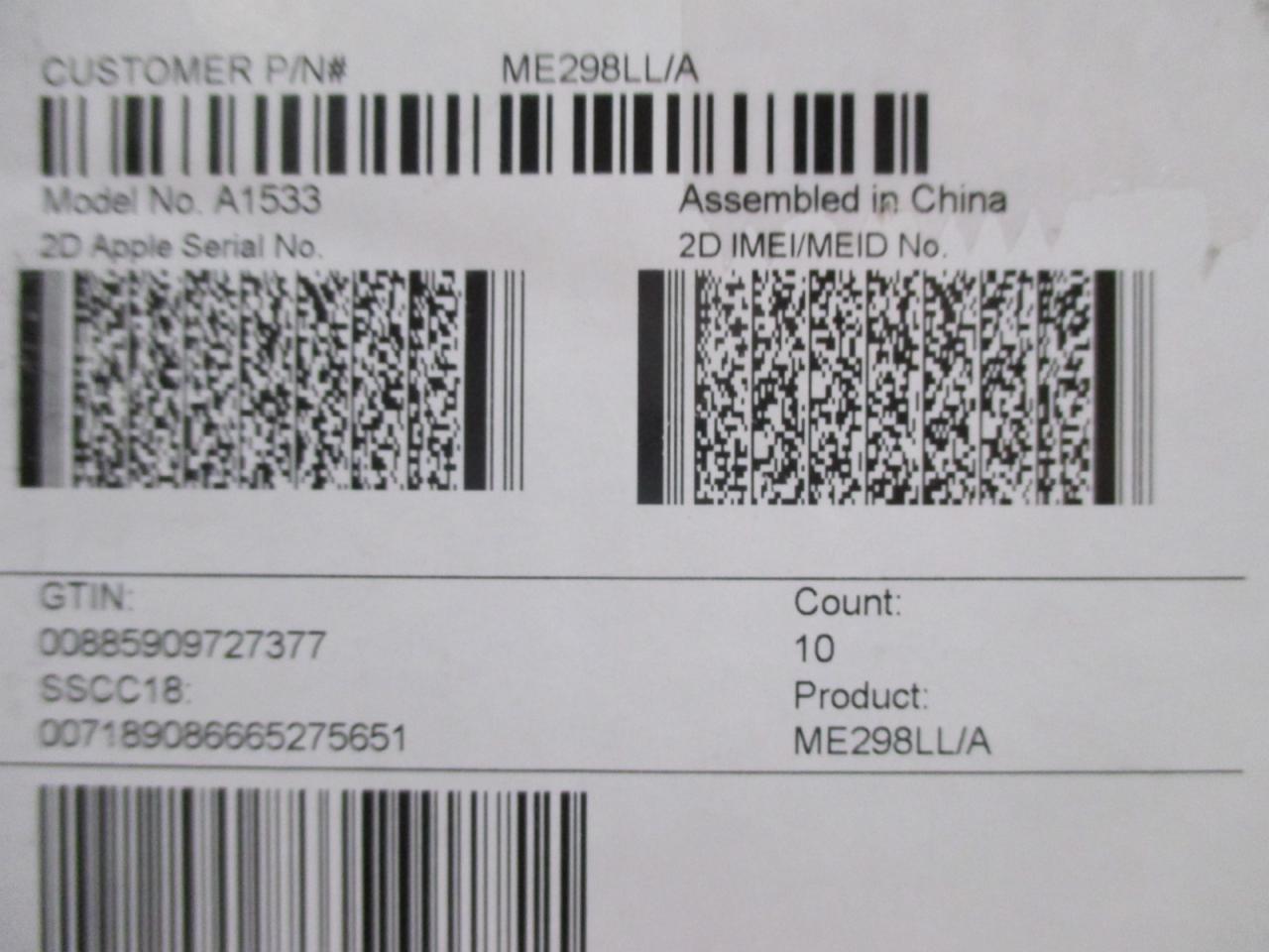 Etykieta z kodami kreskowymi i numerami seryjnymi, w tym IMEI/MEID, dla urządzenia Apple, model A1533, z informacją 'Assembled in China'.