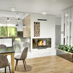 Wnętrze domu: salon z kominkiem obudowanym marmurem, drewnem opałowym w niszy ściennej, jadalnią z drewnianym stołem i krzesłami w odcieniach szarości oraz kuchnią z białymi szafkami i wysokimi...