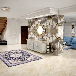 Elegancki salon z marmurową ścianą, lustrem w złotej ramie, białą komodą, wzorzystym dywanem i niebieską sofą chesterfield w stylu glamour.