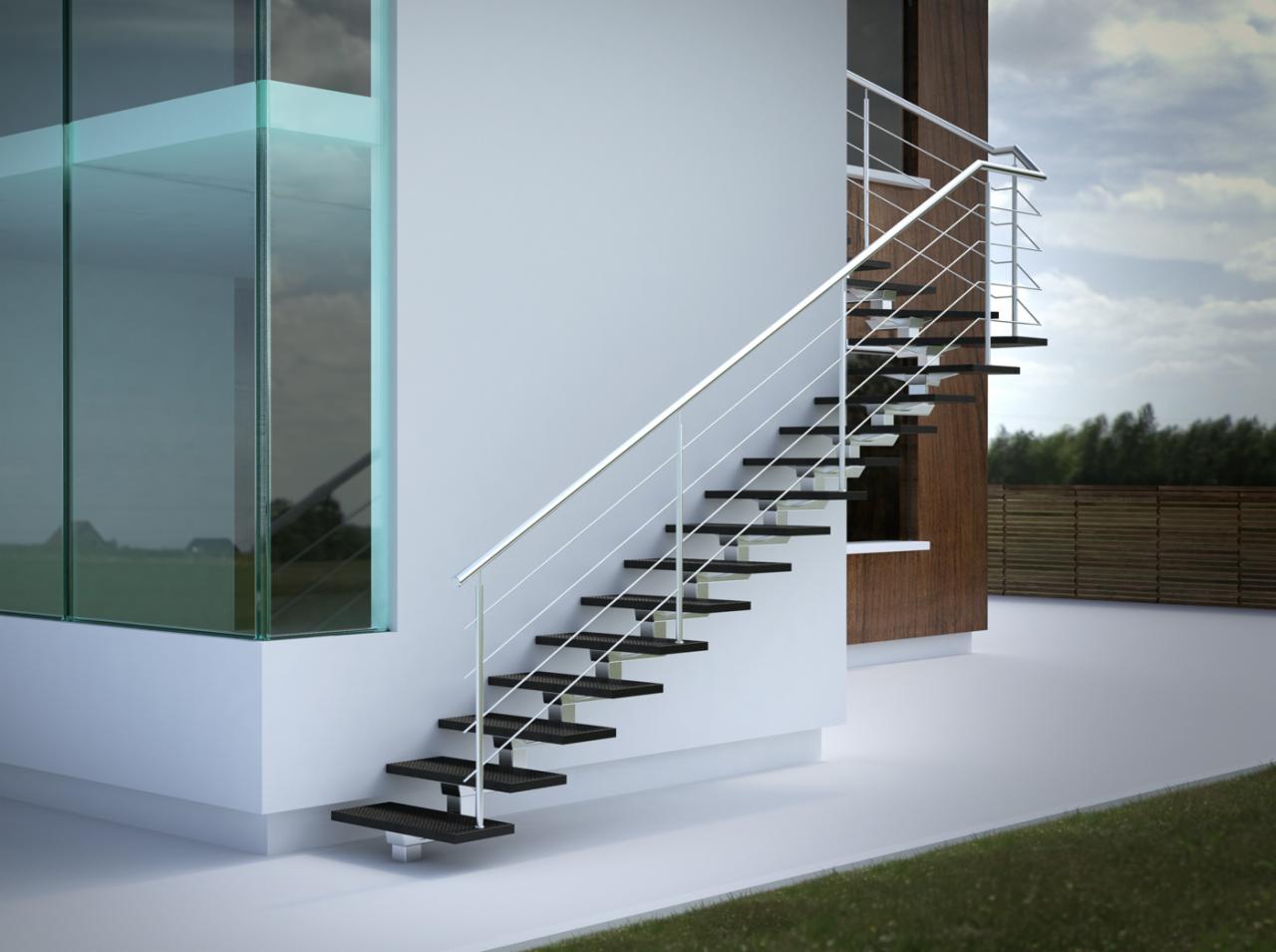 Minimalistyczne schody z metalowymi stopniami i srebrną balustradą, prowadzące na zewnątrz budynku z nowoczesną szklaną fasadą i drewnianym wykończeniem.