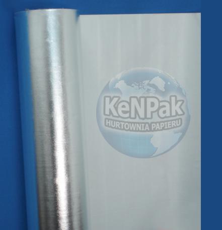 Rolka srebrnej folii laminowanej z widocznym logo 'KenPak Hurtownia Papieru' na tle niebieskiej ściany.