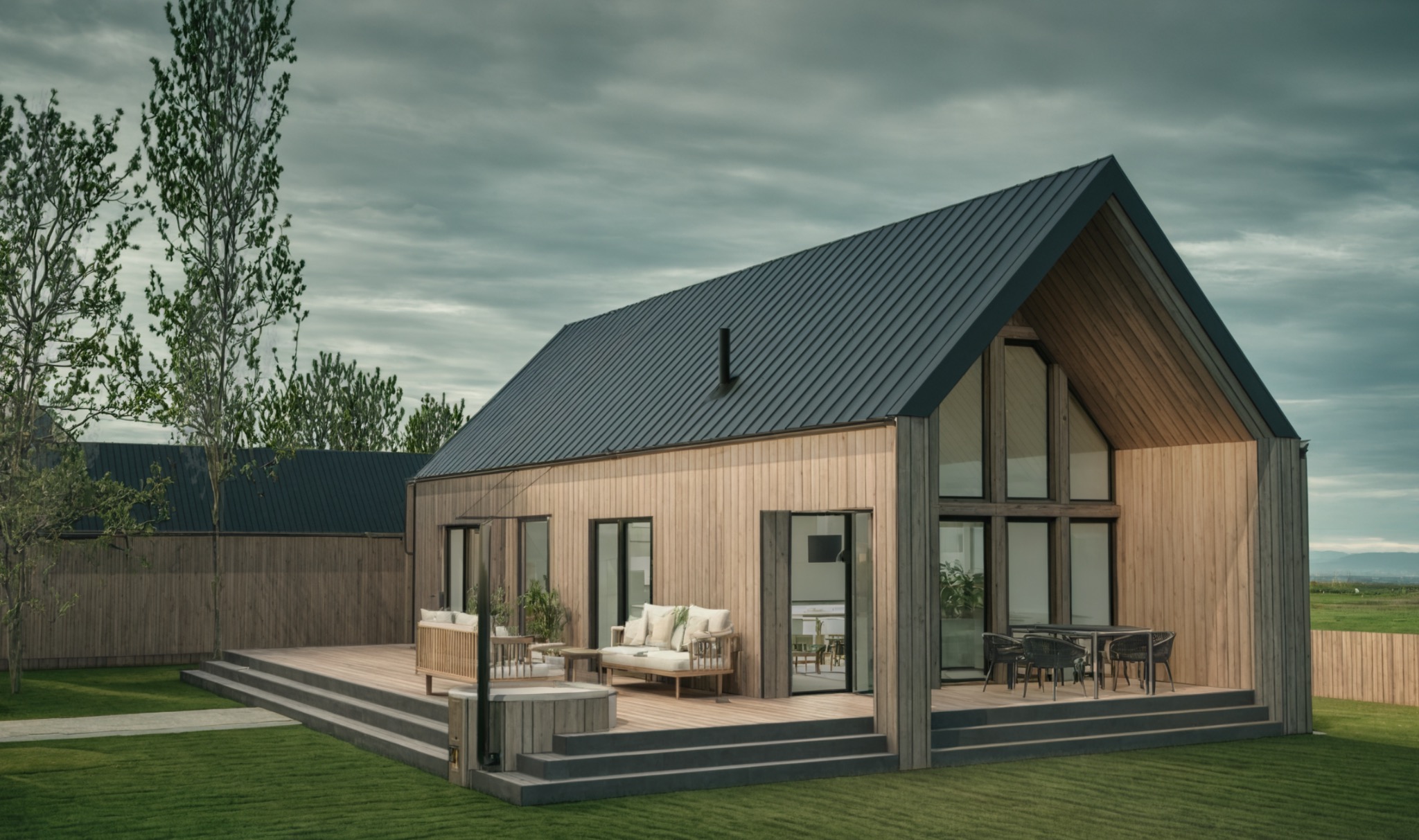 Nowoczesny dom szkieletowy z drewnianą elewacją i dużymi oknami, taras z meblami ogrodowymi, zielony trawnik, pochmurne niebo w tle. Minimalistyczny design.